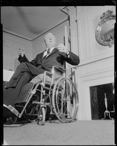 Mayor John F. Collins in front of the fireplace