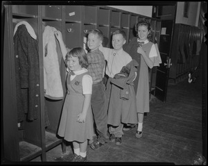 Mayor-elect John F. Collins's children, Peggy, Thomas, John Jr. and Patricia Collins hanging their coats