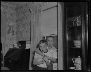 Thomas and John Jr. Collins clowning around at home