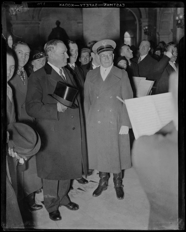 Governor James M. Curley watches the band