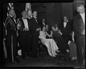 Mary Curley, seated left, at the Inaugural Ball with men standing around them