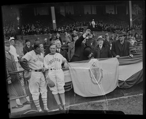 James M. Curley throws out the first ball at Braves field with team members of Boston and New York looking on