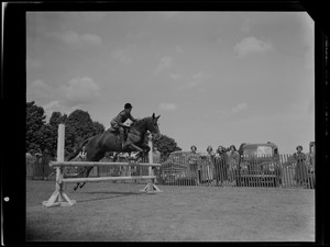 Nat Frew on horse, jumping poles