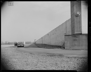 Vehicle parked next to the wall structure of Norfolk State Prison