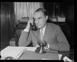 Edward R. Mitton, vice-president of the Jordan Marsh Company, who is receiving the architects' plans in the contest for design of seven houses to be constructed in or near Boston this summer