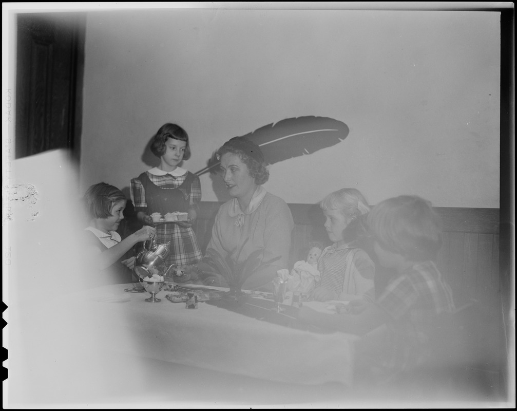 Mrs. Edward Mitton of Brookline, was the guest of these young members of the Girls' Club of Boston: Alice Heatley, Karen Merick, and Nancy Geysen