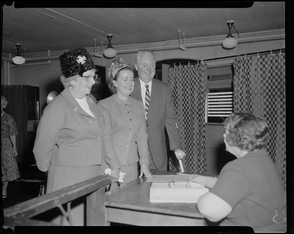 Mayor Collins, with his wife Mary and his mother, Mrs. Margaret Collins, at voter check-in