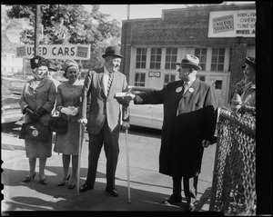 Mayor Collins, with his wife Mary and his mother, Mrs. Margaret Collins, walking into the polling place