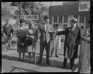 Mayor Collins, with his wife Mary and his mother, Mrs. Margaret Collins, walking into the polling place