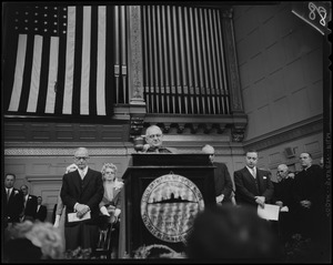 Man at the podium, addressing the room, during Mayor Collins inauguration