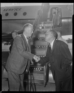 A man greets Secretary of State Christian Herter on his visit to Boston