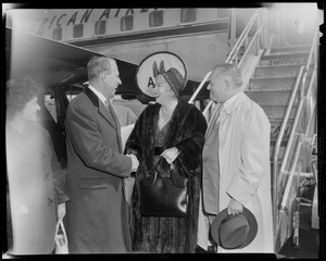 Lana Turner and greeted by City Greeter John A. Brown upon arrival at Logan International airport