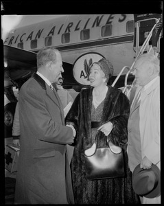 Lana Turner and greeted by City Greeter John A. Brown upon arrival at Logan International airport