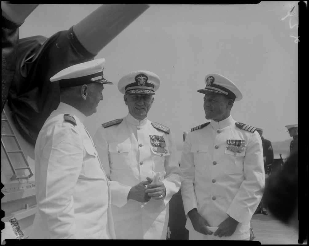 Captain J.F. Enright, left, and Captain G.T. Ferguson, right, with another officer at the U.S.S. Boston change of command ceremonies at Charlestown Navy Yards