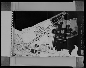 A photograph of a booklet cover with plans of a campus for U.Mass Boston