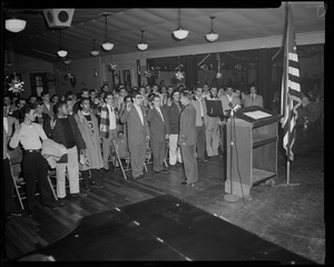 Lieut. Col. William A. Somerby Jr., in front of the podium swearing in U.S.A.F. recruits