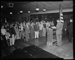 Lieut. Col. William A. Somerby Jr. at the podium swearing in U.S.A.F. recruits