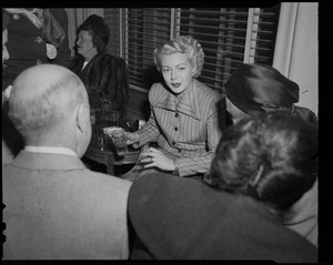 Lana Turner meeting with a group of people