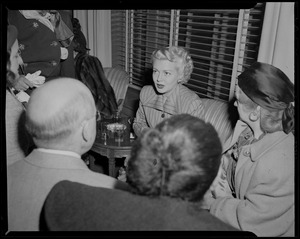 Lana Turner meeting with a group of people