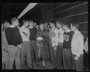 Lana Turner with men in collegiate sweaters including Harvard, Boston University and Tufts