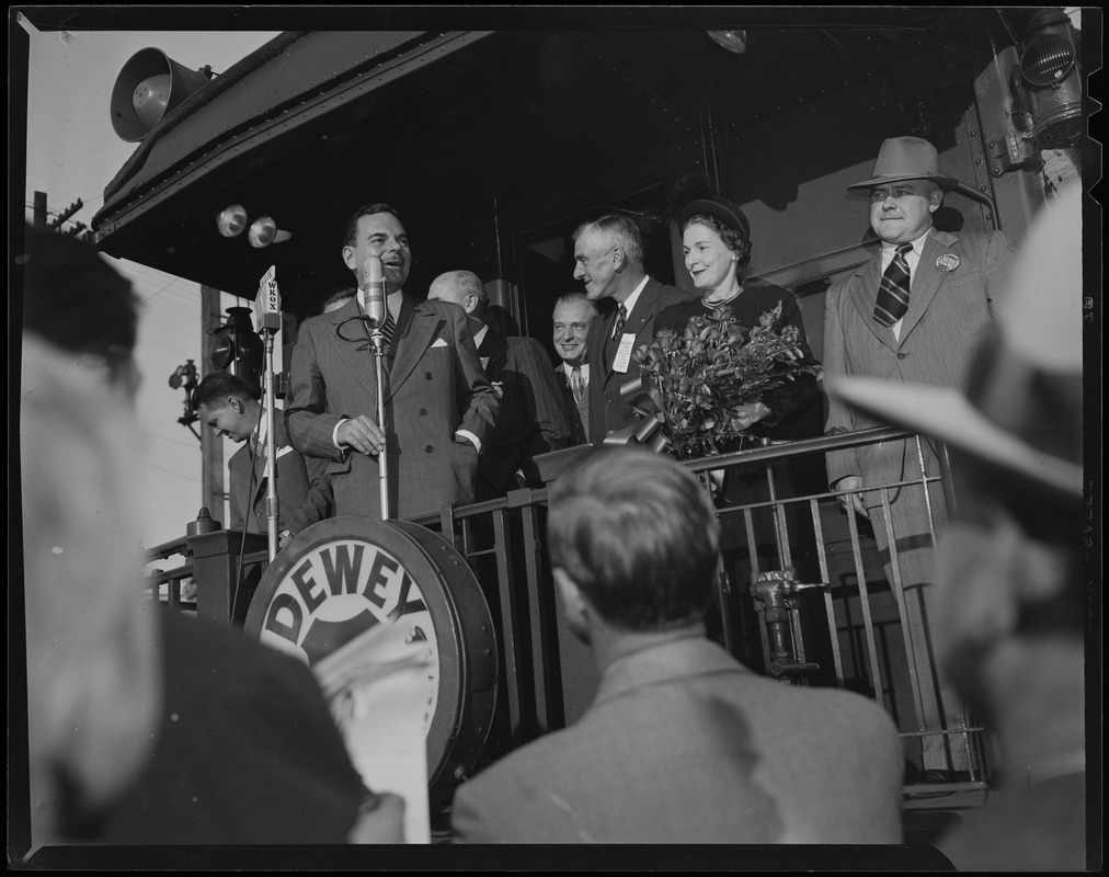 Thomas E. Dewey approaches the microphone on the back of the train car