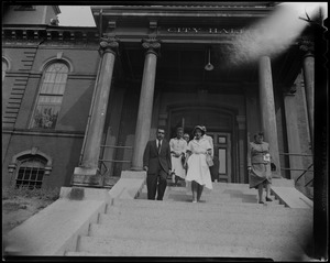Lilian, Princess of Réthy and Leopold III with others, walking down the steps of Gloucester City Hall