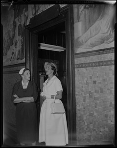 Lilian, Princess of Réthy with another woman in a room below a mural at Gloucester City Hall
