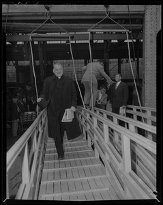 Cardinal Cushing walking from the dock to the ship