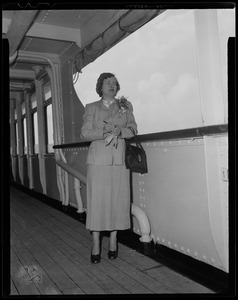 Woman posing on ship deck