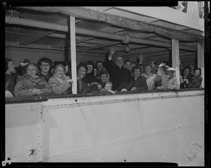 Group with Cardinal Cushing in the middle, waving to the crowd from the ship