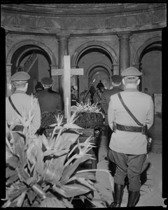 Officials at the corners of the casket holding James M. Curley, from the back