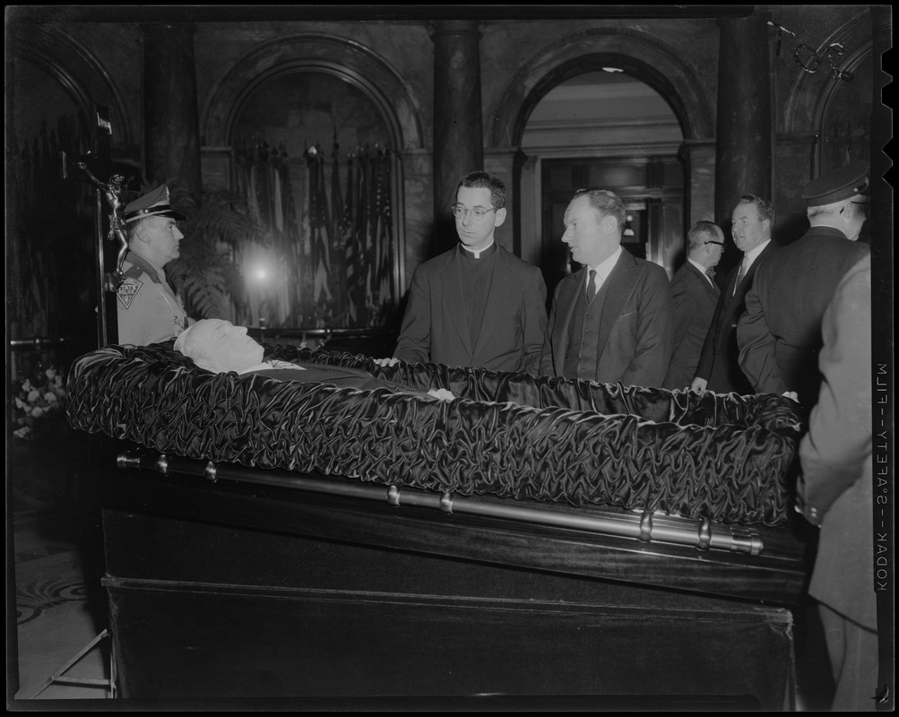 Reverend Francis Curley and George Curley in the Hall of Flags for father James M. Curley's wake