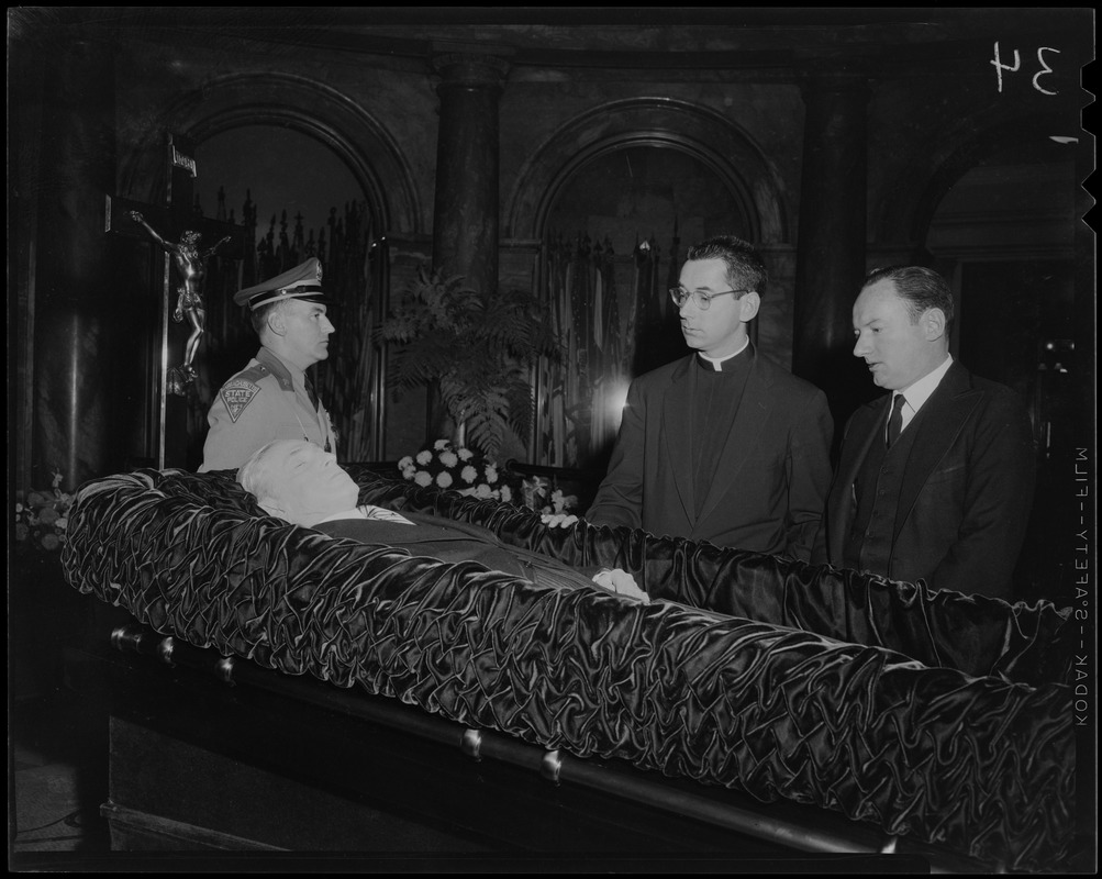 Reverend Francis Curley and George Curley in the Hall of Flags for father James M. Curley's wake