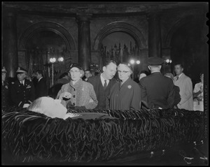 Mourners, including son George Curley, middle, in the Hall of Flags for James M. Curley's wake