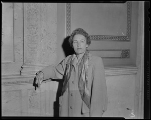 Woman standing along a wall in the State House