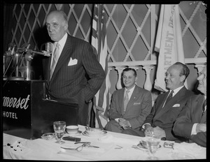 A man addressing the room at a reception for William Randolph Hearst Jr. at the Somerset Hotel