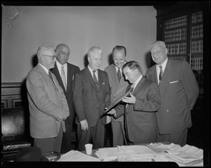 Men presenting William Randolph Hearst Jr. with an award