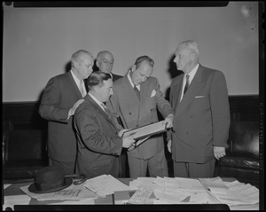 Men presenting William Randolph Hearst Jr. with an award