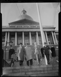 William Randolph Hearst Jr. walking down the stairs of the State House with three other men