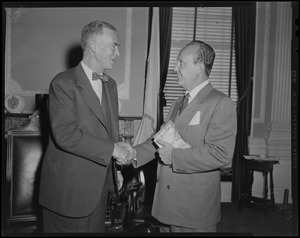 Governor Herter and William Randolph Hearst Jr. shaking hands