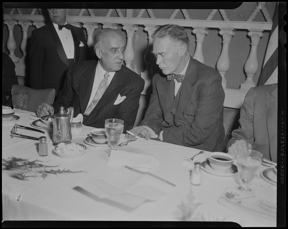 Governor Herter and another man talking at the reception for William Randolph Hearst Jr. at Somerset Hotel