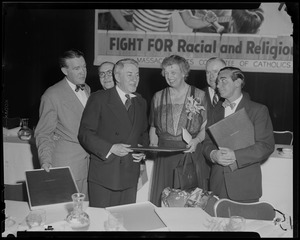 Eleanor Roosevelt standing with coach Frank Leahy of Notre Dame, far left, and Eddie Cantor, far right, and others at the Massachusetts Committee of Catholics, Protestants and Jews dinner