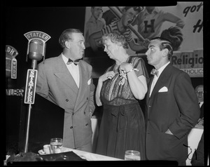 Eleanor Roosevelt standing between coach Frank Leahy of Notre Dame and Eddie Cantor at the Massachusetts Committee of Catholics, Protestants and Jews dinner