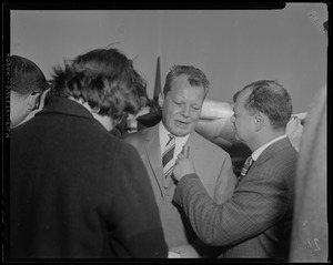 Willy Brandt, West Berlin mayor, speaking into a microphone that another man is holding