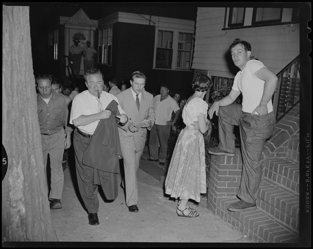 Sam Silverman, with cigar, and a group of people standing outside his ...