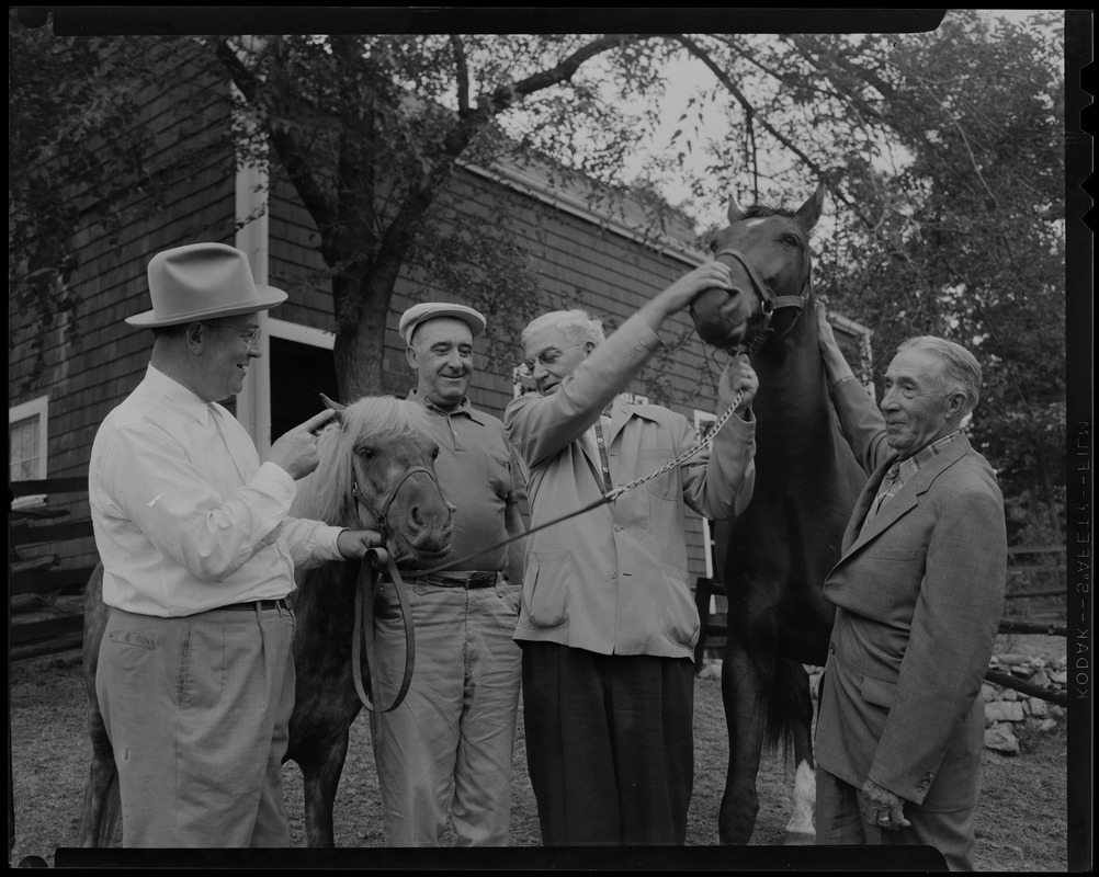 Walter Gibbons, Jimmy Jordan, Paul Wixom and one other man standing with horses