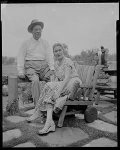 Walter and Madeline Gibbons sitting outside