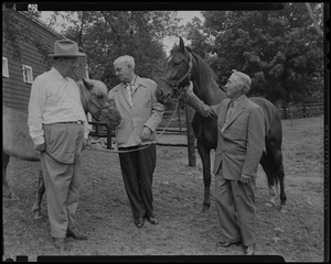 Walter Gibbons, Paul Wixom and one other man next to two horses