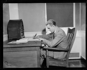 Randolph Hearst at desk, writing