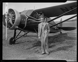 Randolph Hearst posing with an airplane